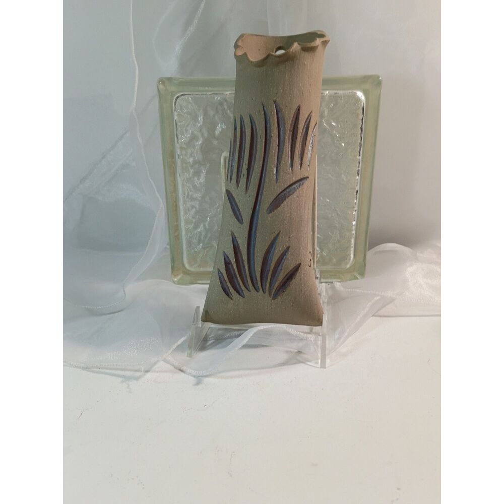 This is a handmade ceramic wall pocket vase and is vintage